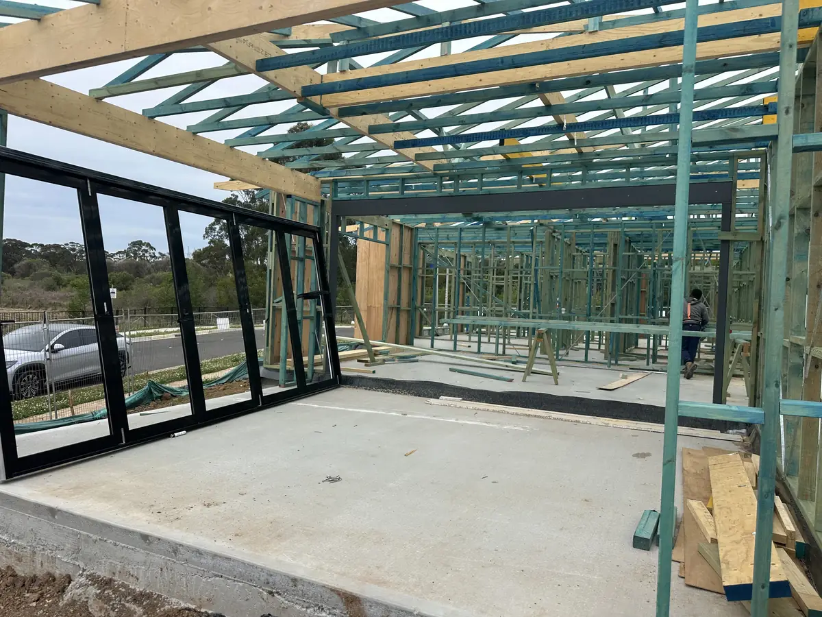 Timber framing with windows and sliding doors installed