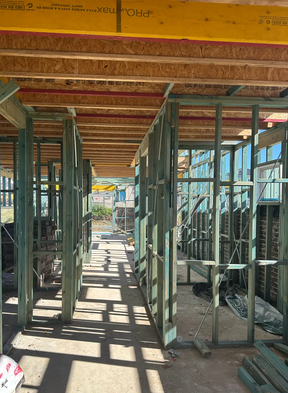 Walk-through under a timber floor frame between wall frames